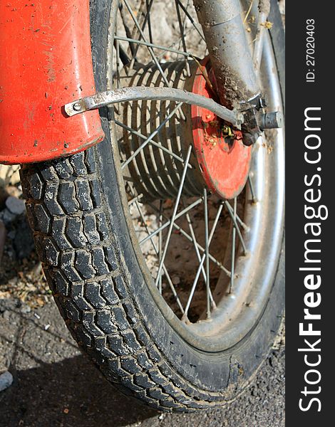 Old wheel motorcycle close up