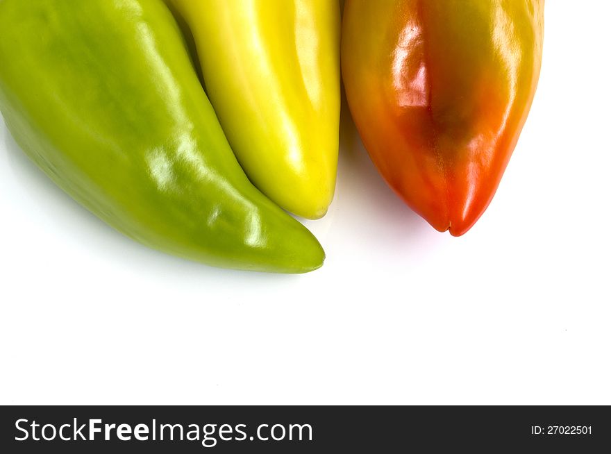 Three colorful bell peppers,  on white