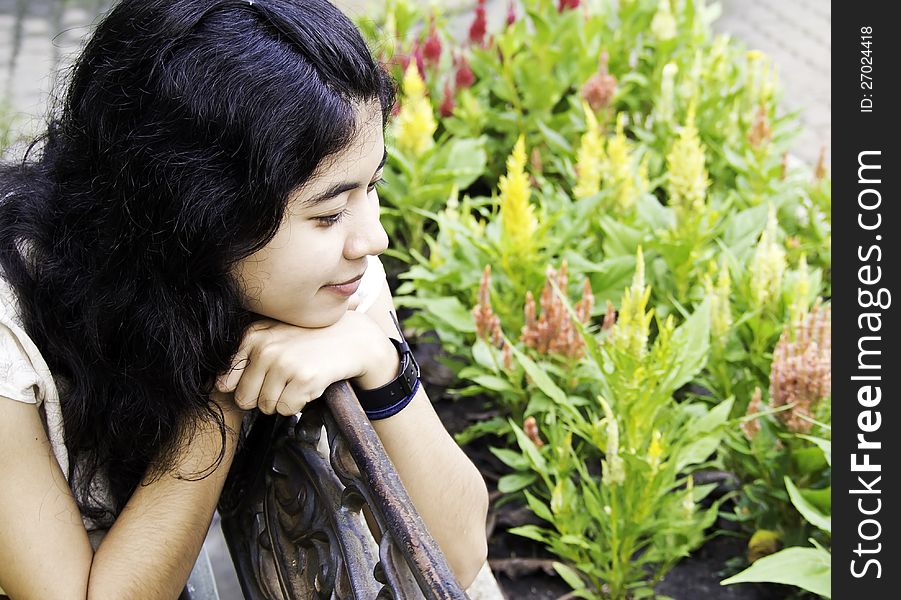 Woman enjoying flowers meadow in garden