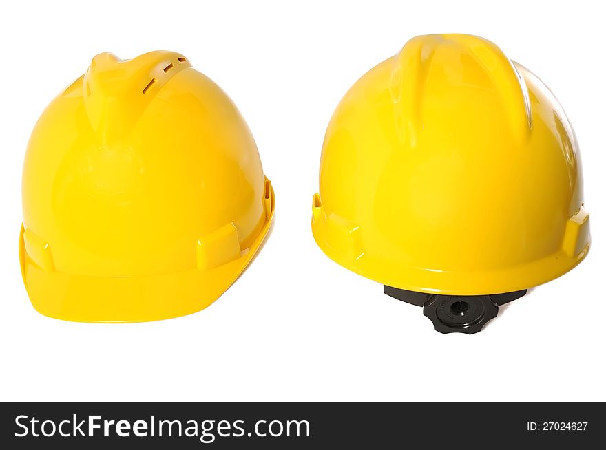 Two yellow construction helmet over white background. Two yellow construction helmet over white background