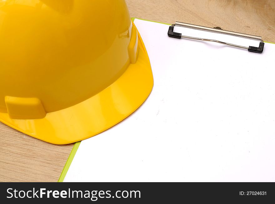 Yellow Helmet And Clipboard