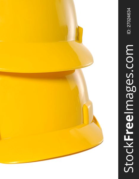 Two yellow construction helmet over white background. Two yellow construction helmet over white background