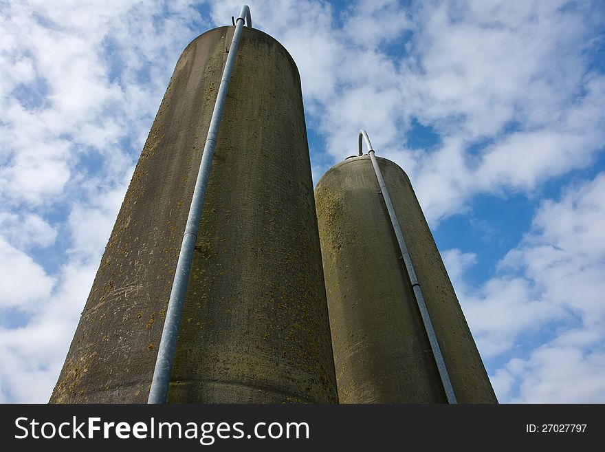 Agriculture farm grain silos in vertical angle facing the sky