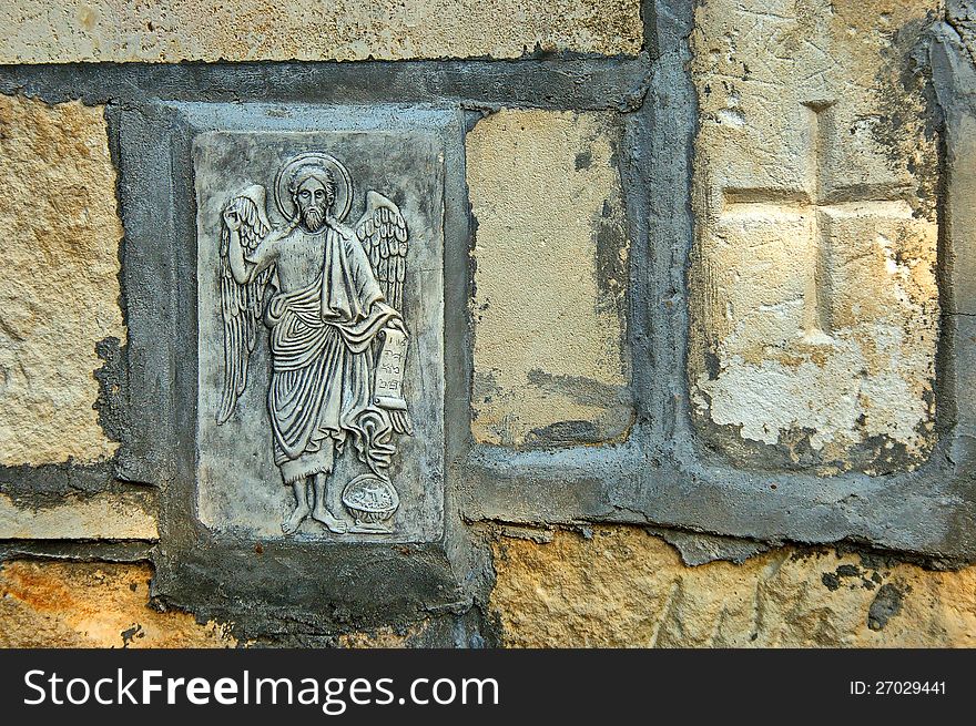 The rock monastery St Dimitrii of Basarbovo. The mural painting in the yard of monastery. Find it in the picturesque valley of the Rusenski Lom River, Bulgaria