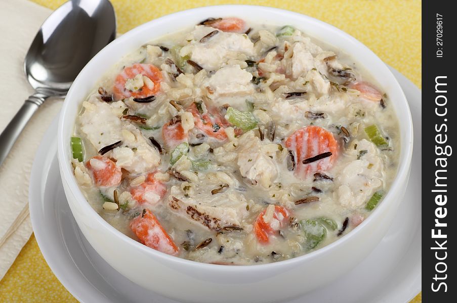 Bowl of chicken and rice soup with vegetables. Bowl of chicken and rice soup with vegetables