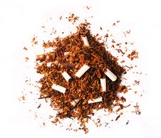 Pile Of Tobacco Leaves With Broken Cigarettes Royalty Free Stock Photography Pile Of Tobacco Leaves With Broken Cigarettes Royalty Free Stock Photography
