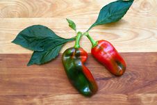 Two Peppers On Cutting Board Royalty Free Stock Photos Two Peppers On Cutting Board Royalty Free Stock Photos