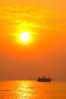 Fishing Boat In Sunset Silhouette Stock Image