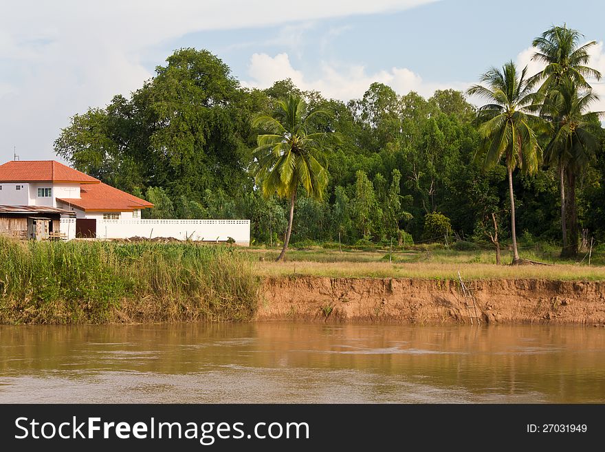 Soil erosion, coastal rivers near homes with red roofs coconut. Soil erosion, coastal rivers near homes with red roofs coconut.