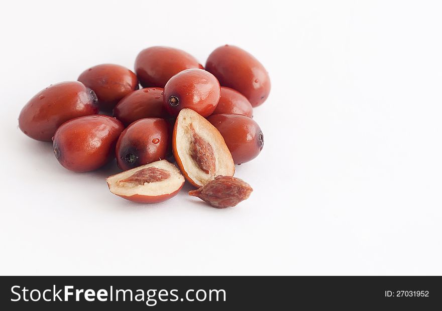 Berries Chinese date or zizifus on a light background without leaves. Berries Chinese date or zizifus on a light background without leaves