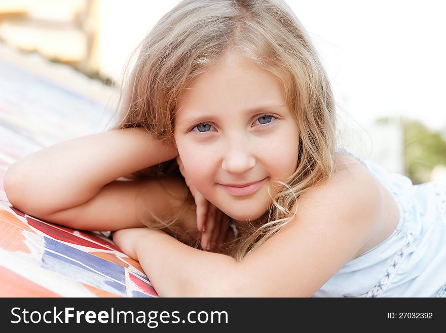 Portrait Of A Pretty Blond  Girl Outside