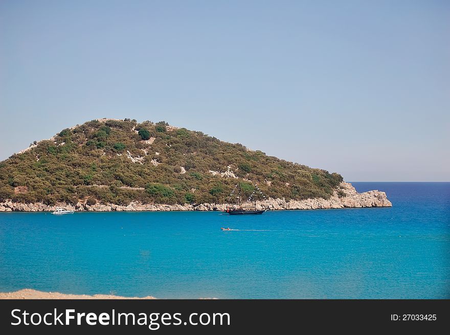 Green Island and the surrounding turquoise, calm sea with boats. Green Island and the surrounding turquoise, calm sea with boats