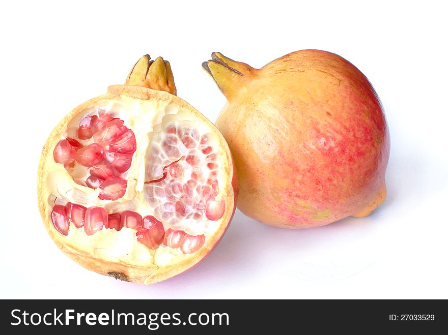 Pomegranate fruit with half isolated on white background