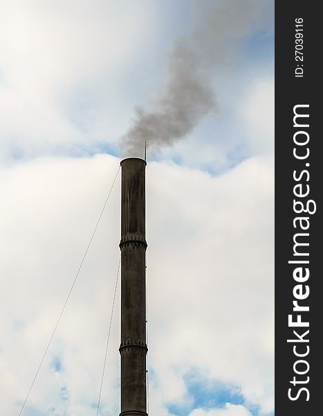 Problem of environmental conditions. pollution smoke from manufacturing chimney on a sky background