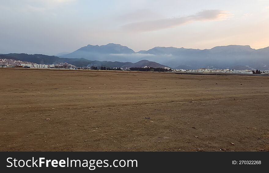 Barren Wasteland Exploring A Large Area Of Soil Devoid Of Grass