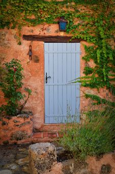 Old Blue Door In Orange Wall Stock Photography Old Blue Door In Orange Wall Stock Photography