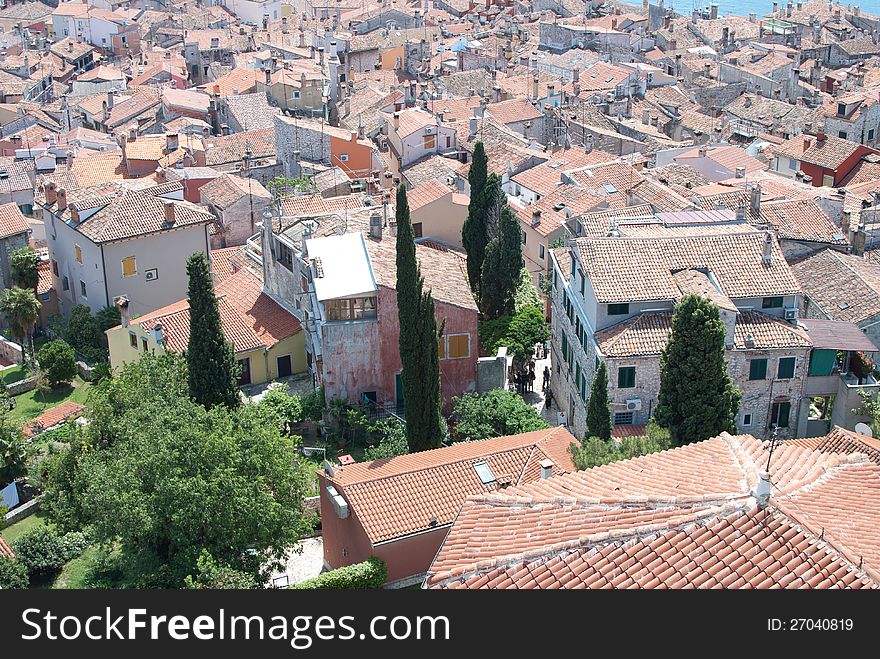 Old stone village with sea of roofs in background