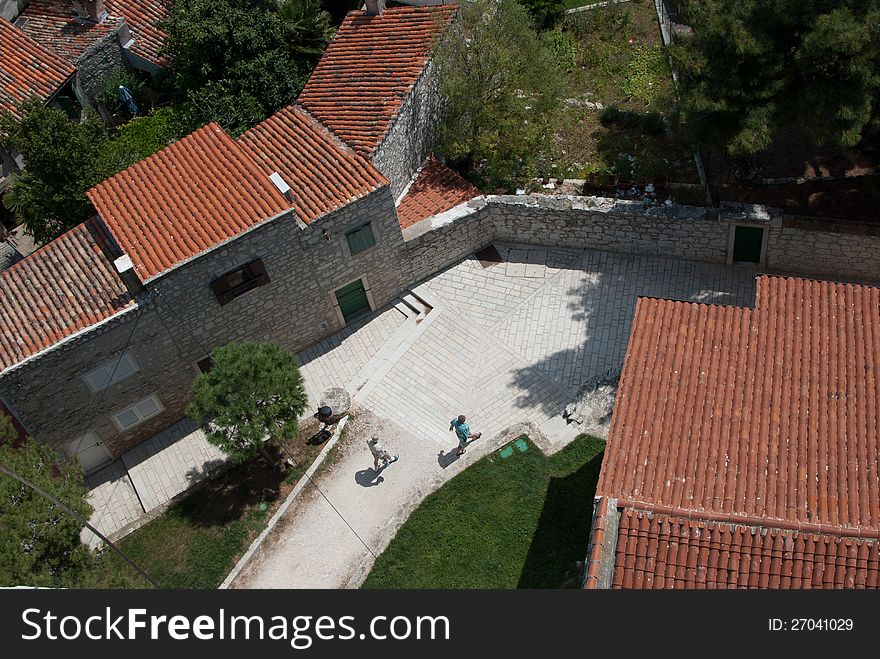 Old mediaeval village streets, white stone pavement and red Mediterranean roof in Croatia (Rovinj), seen form bell church of saint Evfemija. Old mediaeval village streets, white stone pavement and red Mediterranean roof in Croatia (Rovinj), seen form bell church of saint Evfemija