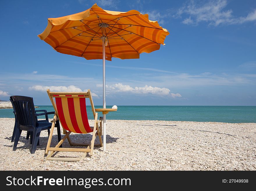 Beach umbrella in the marche sea, Italy.