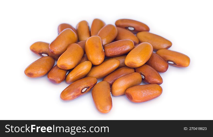 Handful of brown beans on white background. Close-up