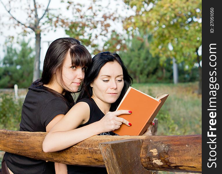 Two female friends on a bench