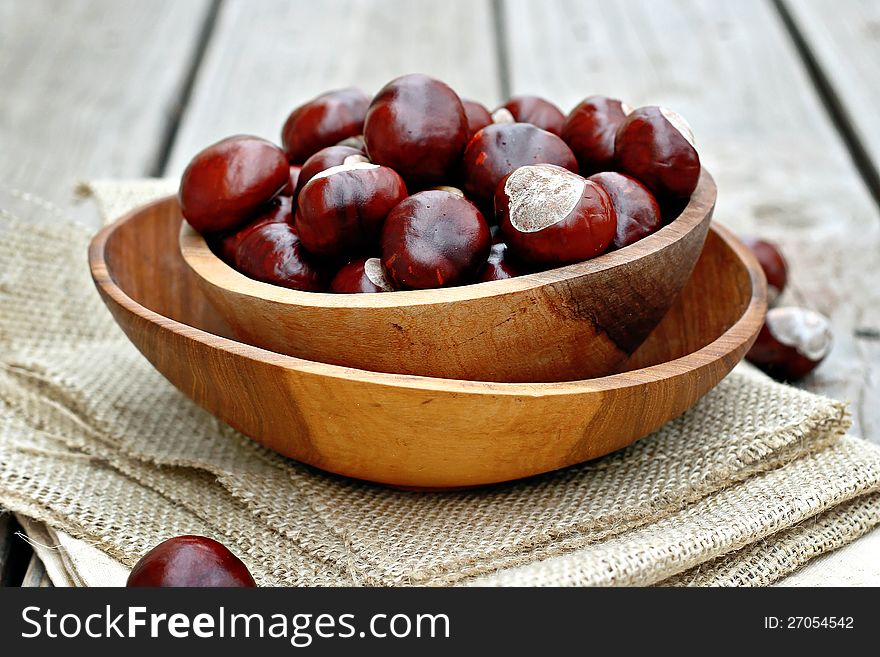Chestnuts in a wooden bowl. Chestnuts in a wooden bowl.