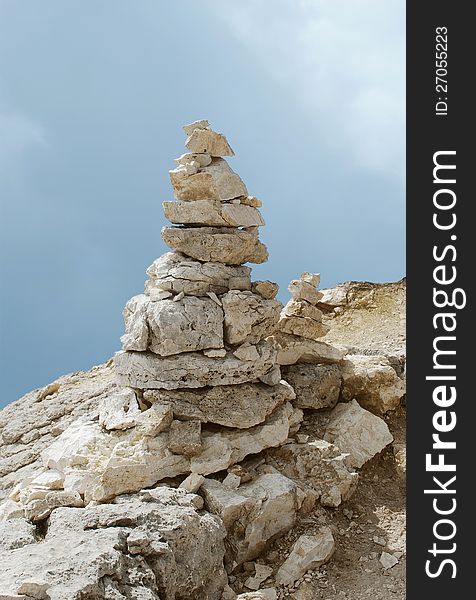 Tower of rough stones and blue sky. Tower of rough stones and blue sky