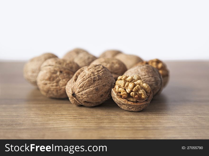 Walnuts on brown woody desk