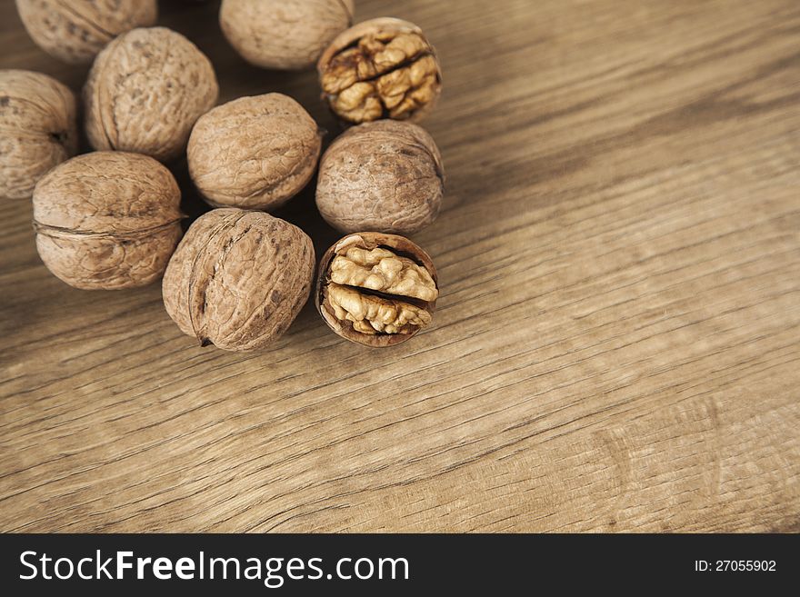 Walnuts on brown woody desk