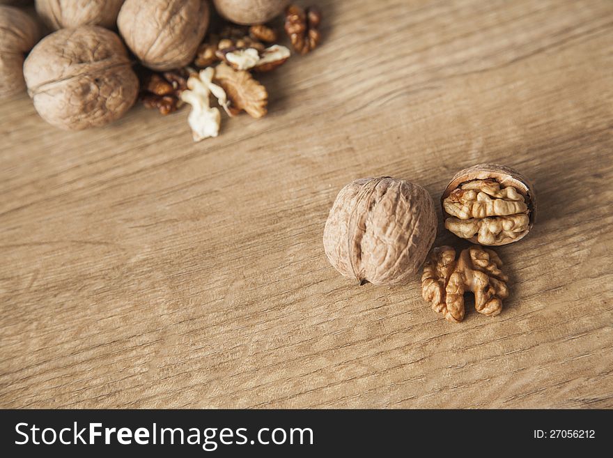 Walnuts on brown woody desk