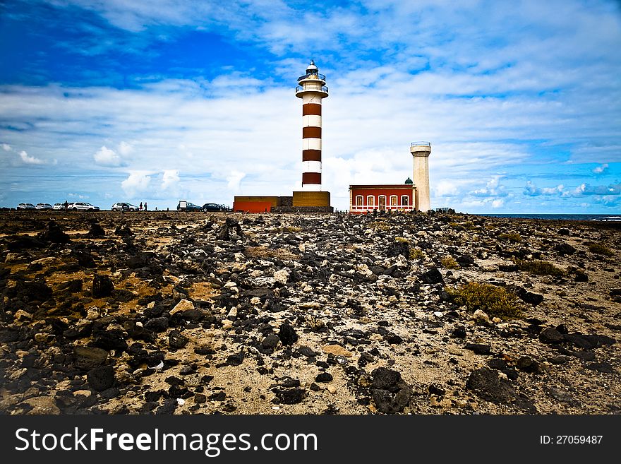 A lighthouse at the western coast of Fuerteventura nearby El Cotillo. A lighthouse at the western coast of Fuerteventura nearby El Cotillo.