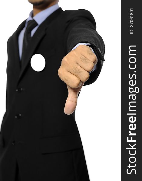 Man with black business suit with blank pinned button give thumb down. You can put your design on the button. Election day background or concept. Man with black business suit with blank pinned button give thumb down. You can put your design on the button. Election day background or concept