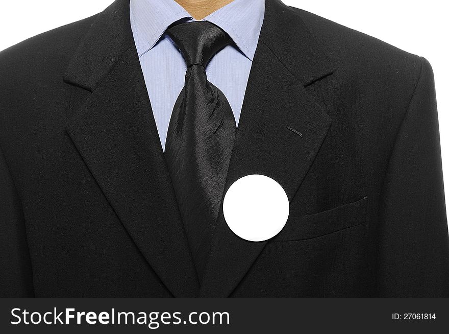 Man with black business suit with blank pinned button. You can put your design on the button. Election day background or concept. Man with black business suit with blank pinned button. You can put your design on the button. Election day background or concept