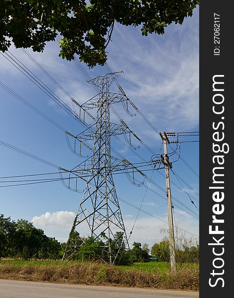 High and low voltage power poles near each other.