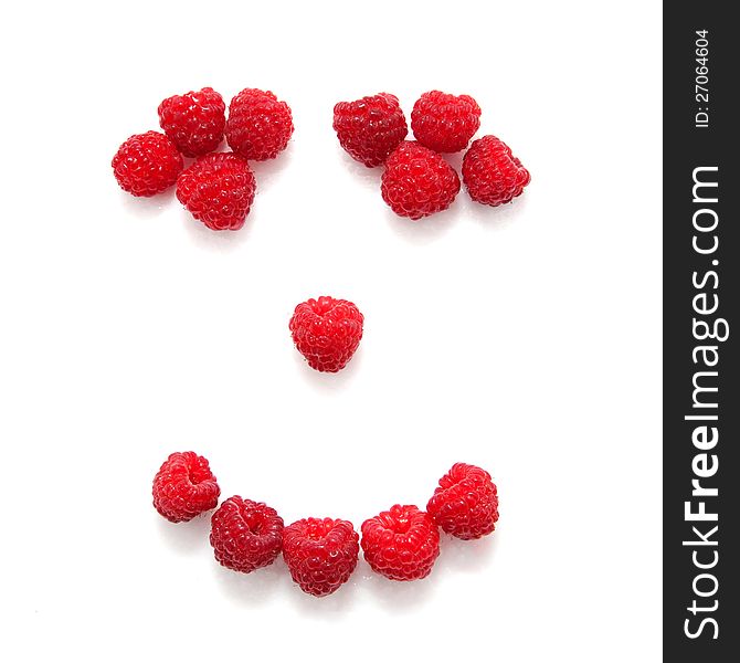 Smile composed of raspberries. Isolated on white background