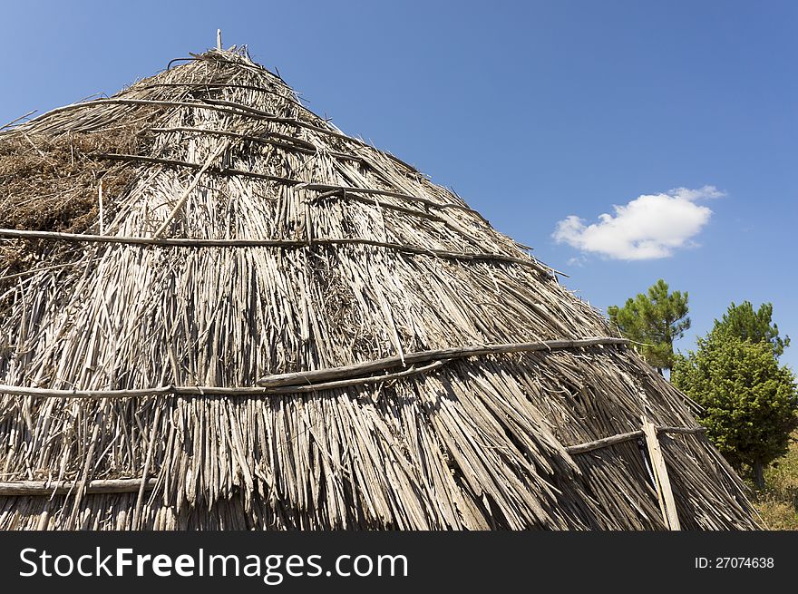 Traditional Straw Hut In Greek Country