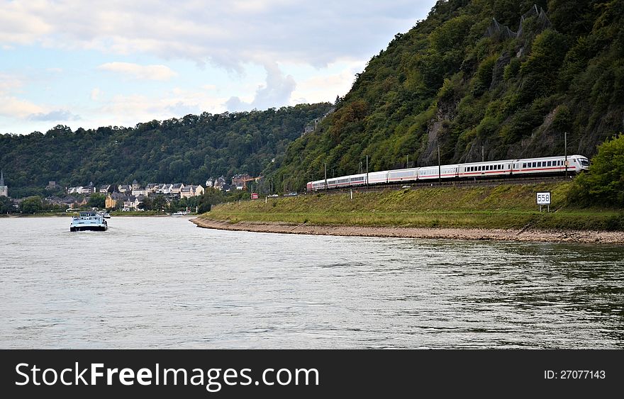 Train travelling along Rhine river at Germany