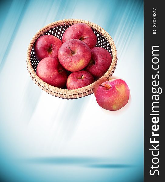 Apples in a basket on gray background. Apples in a basket on gray background