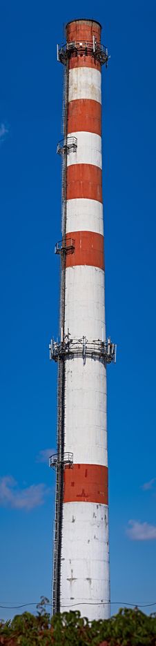 Industrial Brick Chimney With Cellular Equipment Royalty Free Stock Photo