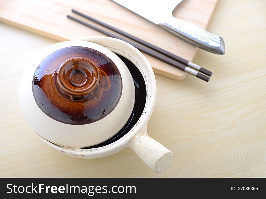 Topview Of Chinese Clay Pot With Chopsticks