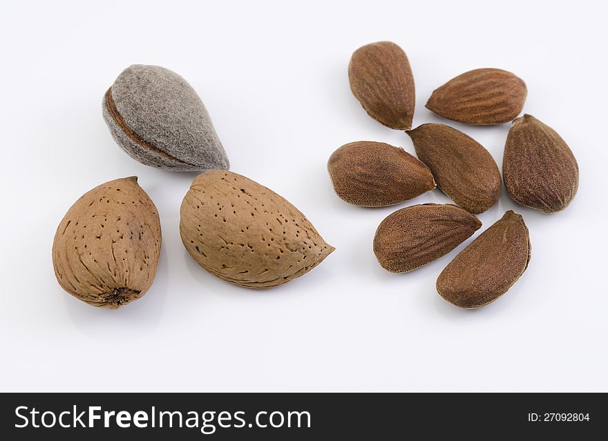 A shot of some almond nuts isolated on white background