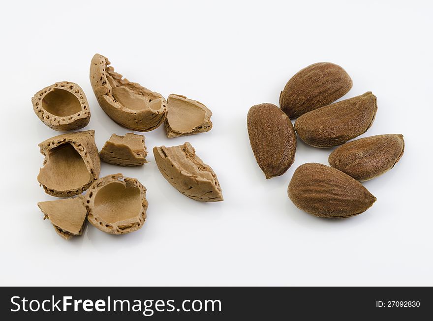 A shot of some almond nuts isolated on white background