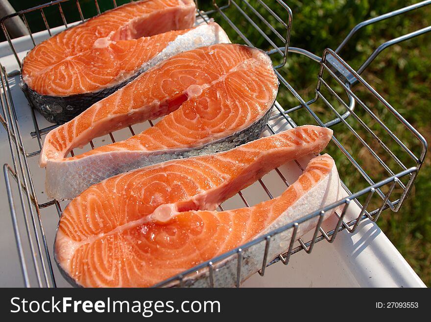 Pieces of salmon for cooking steaks on the grill. Pieces of salmon for cooking steaks on the grill