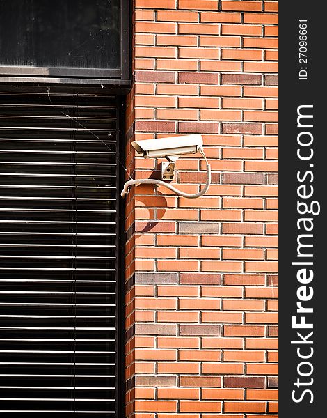 White security camera on office building, safety system
