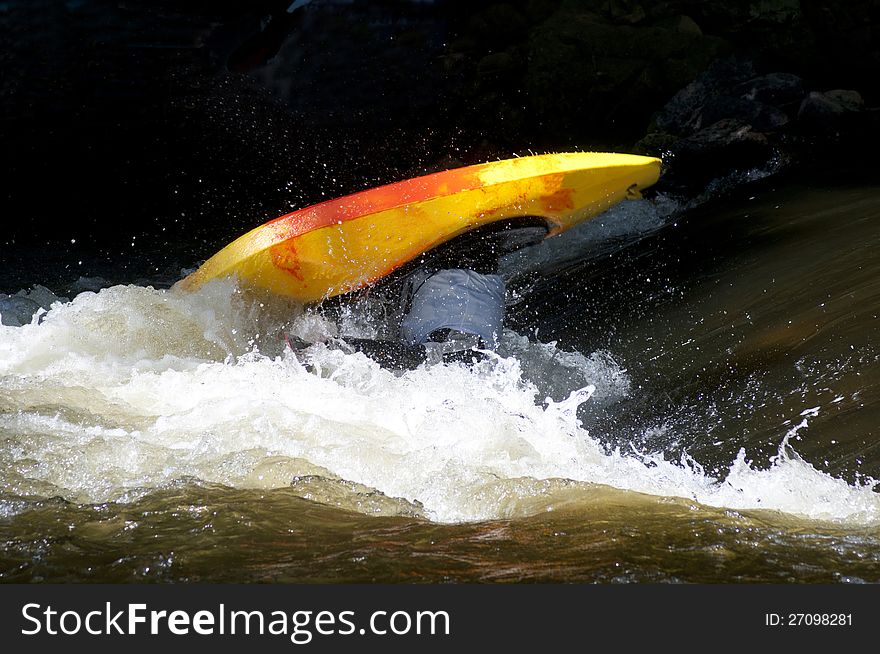 A contestant flips during a kayak competition on the Pigeon River. A contestant flips during a kayak competition on the Pigeon River.