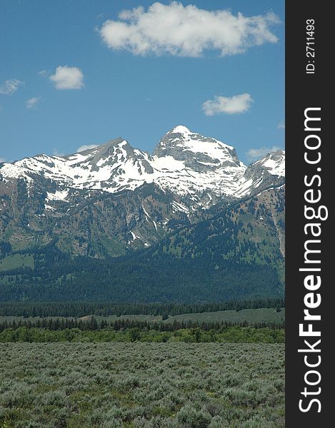 A vertical angle photograph of snow capped mountains in Wyoming. A vertical angle photograph of snow capped mountains in Wyoming.