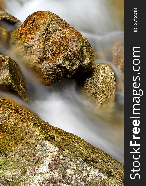 Granite stones in the river in the Giant mountains (Czech Republic)