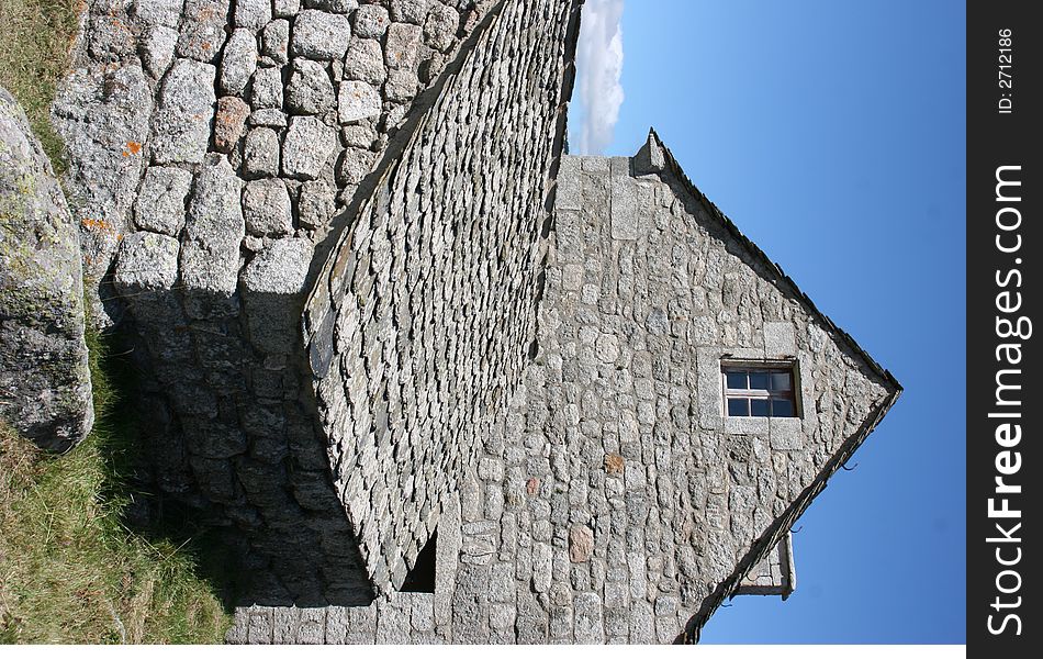 A rocky house lost in a hamlet in france