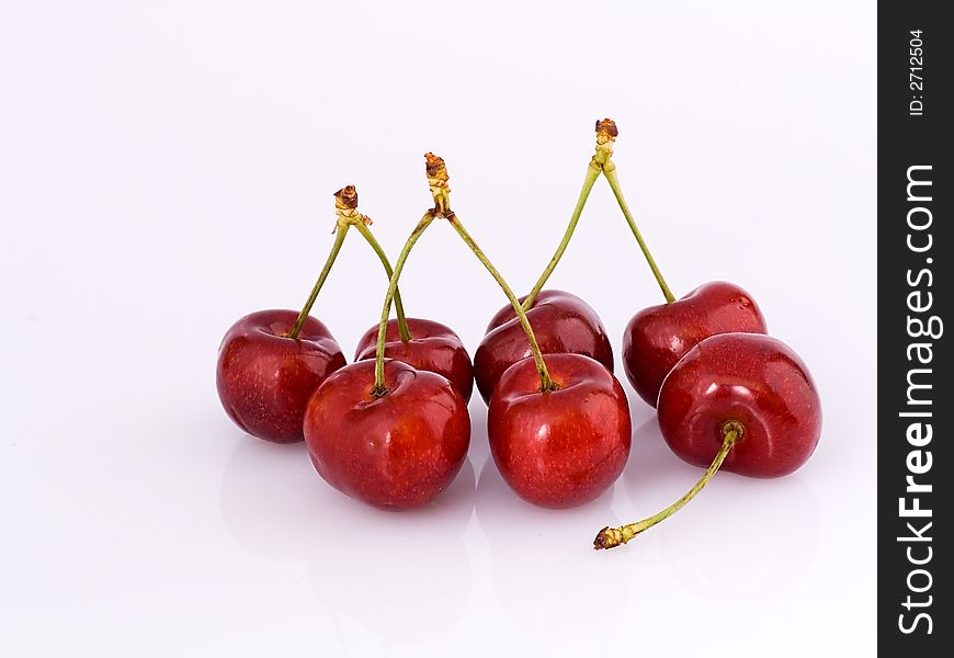 Batch of cherries on the white background