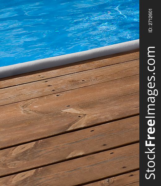 Brown floorboard and azure water. Brown floorboard and azure water